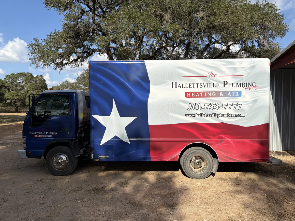 The Hallettsville Plumbing Company truck with its Texas-flag wrap